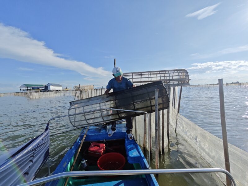 Fishermen at Tam Giang Lagoon